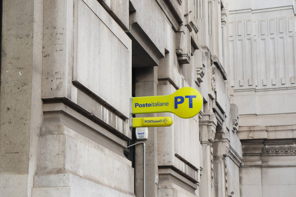 Poste Italiane is the national postal service provider in Italy with It's Bright Yellow Sign Logo and Blue Lettering - Photo, Image