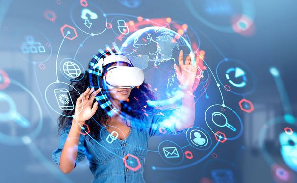 Black woman in vr glasses hands touching earth globe with digital connection hologram, glowing hud with web icons. Concept of global internet and virtual world - Valokuva, kuva
