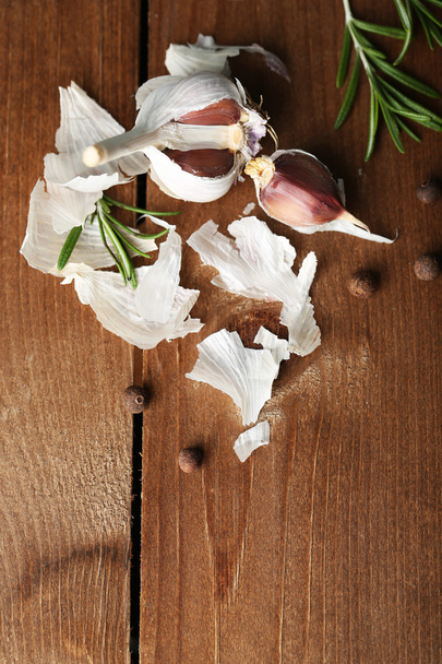 Raw garlic and spices on wooden table - Photo, image