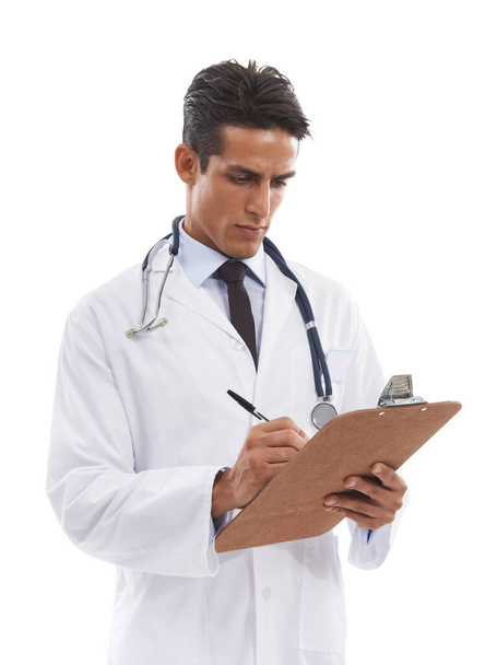 Написання рецепта для ваших потреб у здоров'ї. Гарний молодий лікар робить нотатки на кишені на білому тлі
 - Фото, зображення