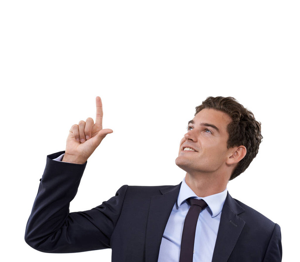 Look up there. A handsome young businessman pointing at copyspace - Foto, Bild