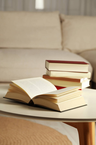 Many different books on white table indoors - Foto, imagen