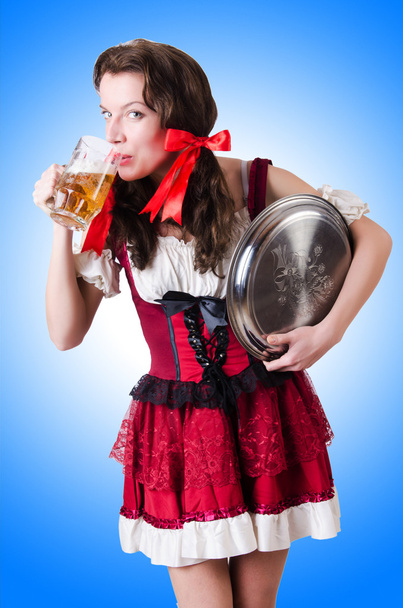 Bavarian girl with tray on blue - Foto, Imagen