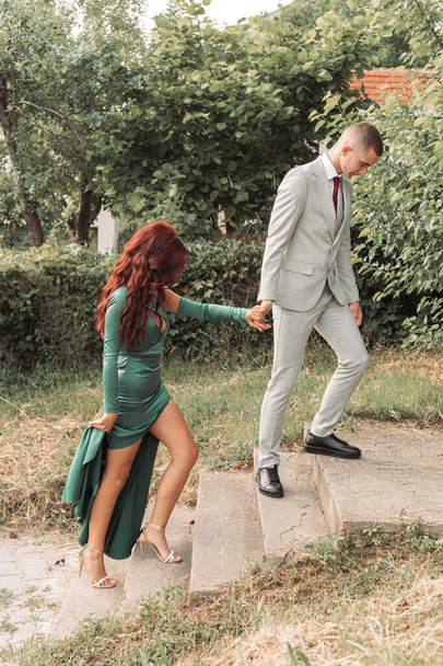 Young teenage couple dressed up for the prom, walking together - Fotografie, Obrázek
