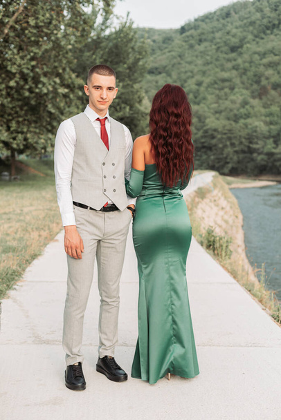 Young teenage couple dressed up for the prom - 写真・画像
