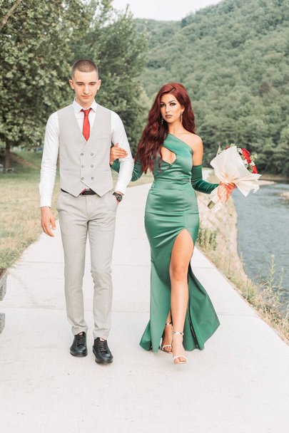 Young teenage couple dressed up for the prom, walking together - Fotografie, Obrázek