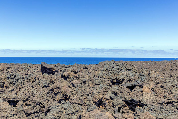 Picture over volcanic coast near El Golfo on Lanzarote during daytime - Photo, Image
