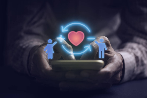 Person happy valentines day Icon of love, warmth, sent to lovers or family and social media interactions on laptop,message, email, comment,hold the heart,internet digital marketing.	 - Fotó, kép
