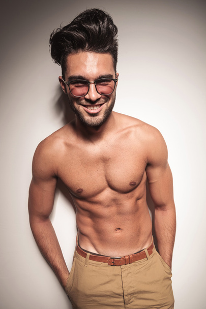 Smiling young casual man posing shirtless  - Photo, Image