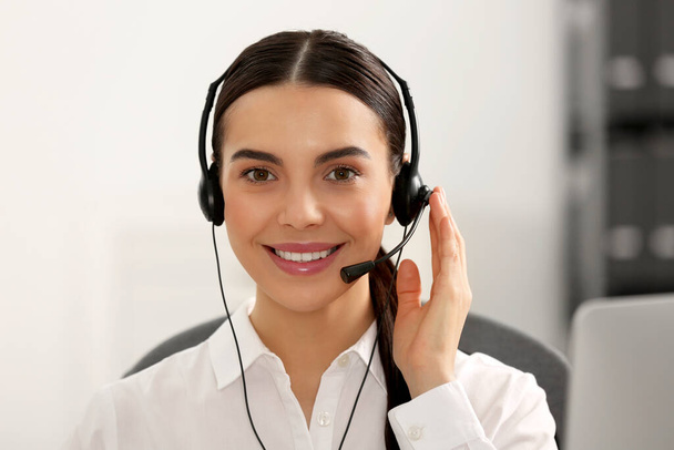 Hotline operator with headset working in office - Foto, imagen