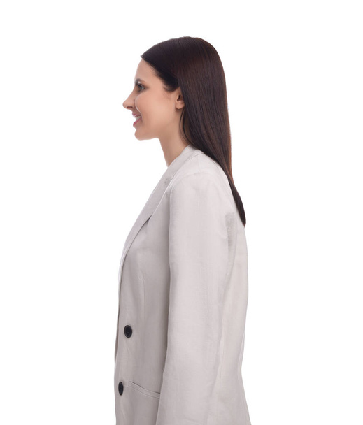 Young businesswoman in suit standing on white background - Fotografie, Obrázek