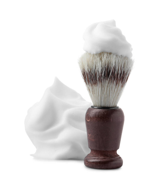Shaving foam and brush on white background - Foto, imagen