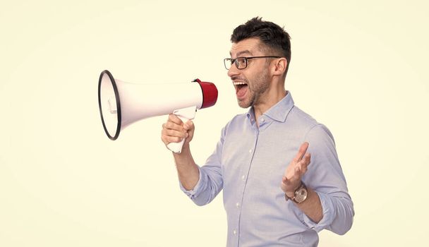 photo of man announcing with megaphone. man announcing with megaphone isolated on white background. man announcing with megaphone in studio. shouting man announcing with megaphone. - Zdjęcie, obraz