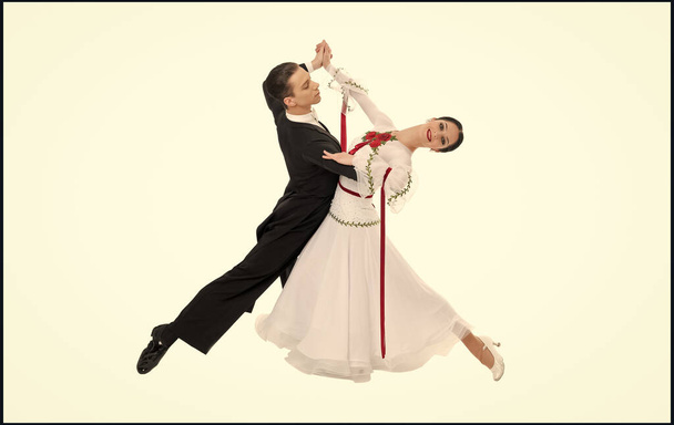 couple of professional ballroom dancers dancing isolated on white background. - Фото, зображення