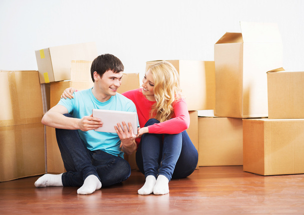 Happy couple moving into new home - 写真・画像