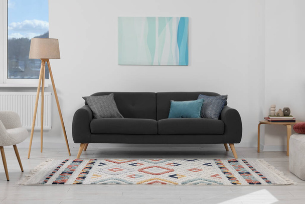 Living room with beautiful carpet and furniture - Фото, зображення