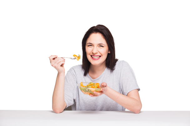 natural beautiful young woman heaving a healthy fruit meal, isol - Photo, Image