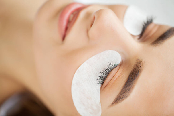 Beautiful Woman with long eyelashes in a beauty salon - Photo, Image