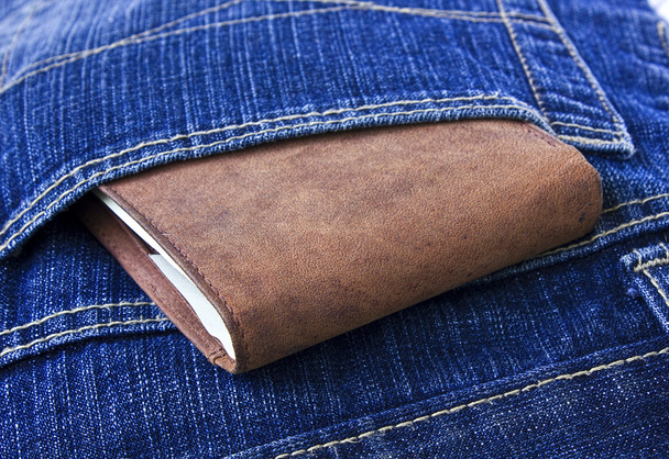 Leather wallet with money in blue jeans.Man's style life - 写真・画像