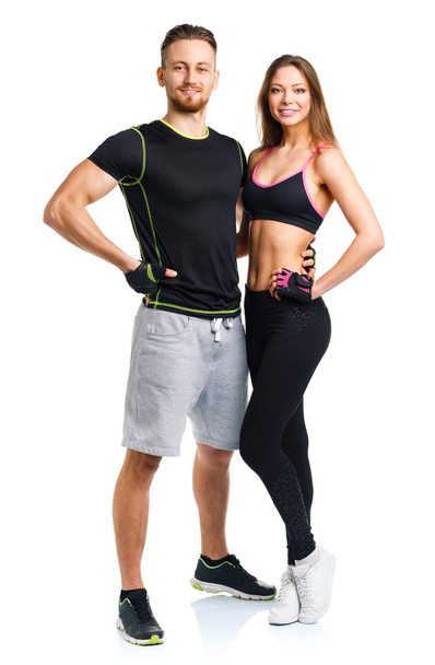 Athletic couple - man and woman after fitness exercise on the wh - Foto, Imagem