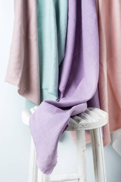 Sewing concept: linen fabric in different colors, selective focus image - Φωτογραφία, εικόνα