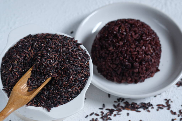 black rice and cooked black rice. This rice has health benefits - Photo, Image