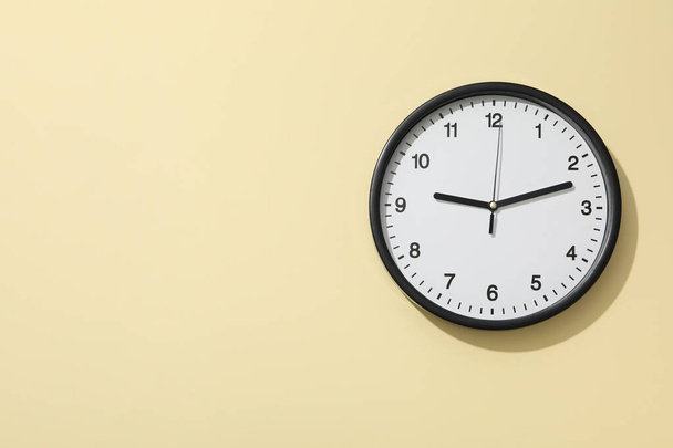 Concept of time change with clock on beige background - Photo, image