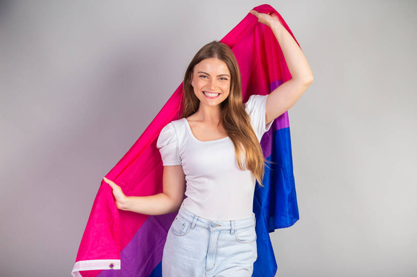 Blonde Brazilian woman with LGBT bisexual flag - Photo, Image