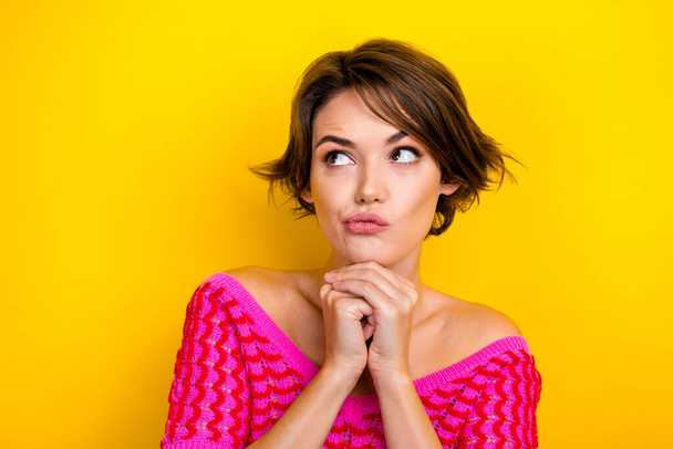 Photo of thoughtful minded cute girl dressed off shoulder shirt look empty space deep thinking isolated on yellow color background. - Фото, изображение