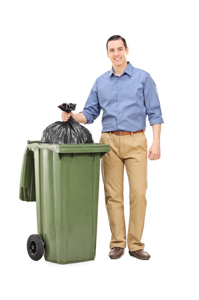 Man throwing out garbage - Фото, изображение