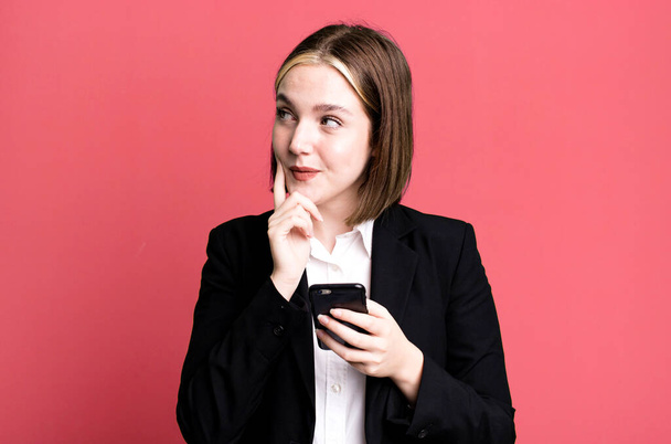young pretty businesswoman using her smartphone - Foto, Bild