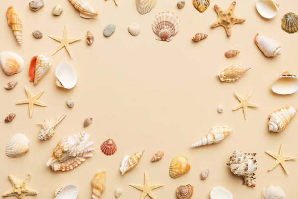 Summer time concept Flat lay composition with beautiful starfish and sea shells on colored table, top view with copy space for text. - Foto, imagen