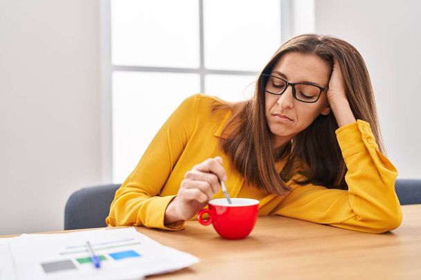 Young woman sleeped drinking coffee at office - Photo, Image