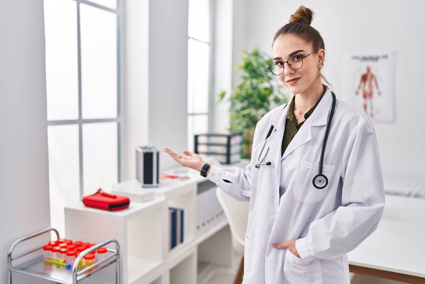 Young woman wearing doctor uniform standing at clinic - Photo, Image