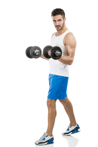 Athletic man lifting weights - Foto, imagen
