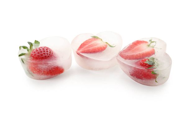 Fresh strawberry frozen in ice on white background - Photo, Image