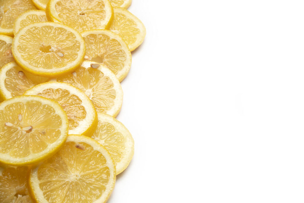 overlapping lemon slices on white background with copy space - Foto, Imagem