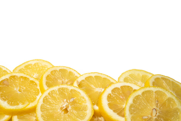 overlapping lemon slices on white background with copy space - Foto, imagen