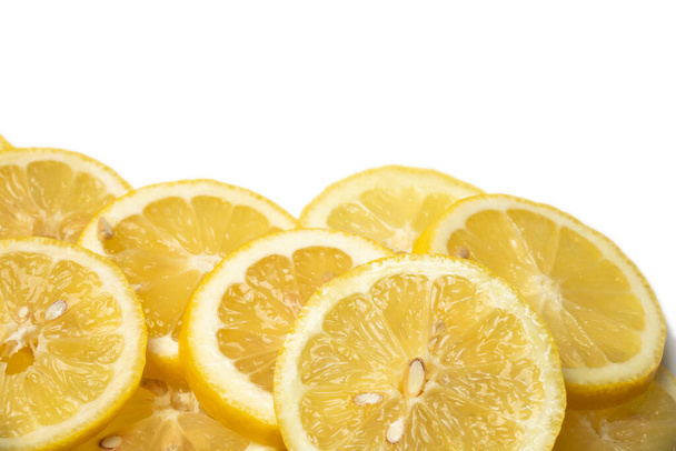 overlapping lemon slices on white background with copy space - Foto, afbeelding