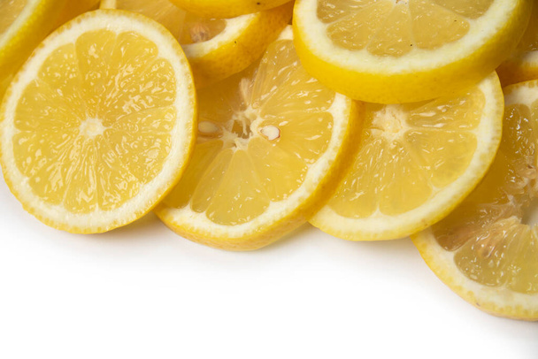 overlapping lemon slices on white background with copy space - Fotoğraf, Görsel