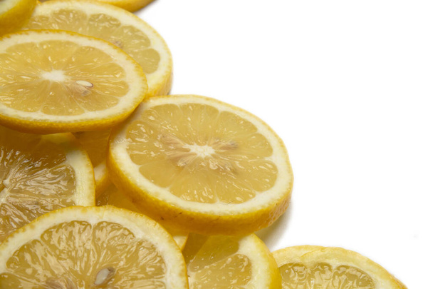 overlapping lemon slices on white background with copy space - Foto, Imagen