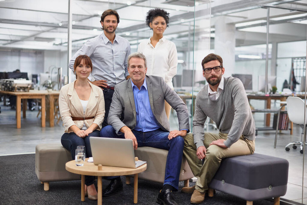 What a team. Portrait of a diverse group of office professionals - 写真・画像