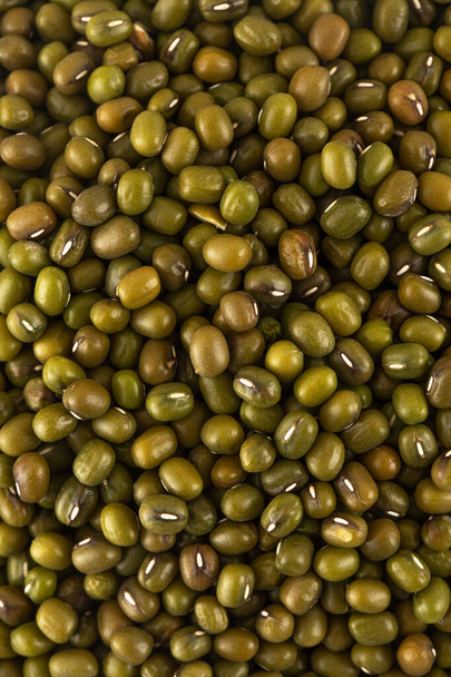 Raw mash beans in full frame close-up. The concept of vegetarianism, vegetable protein. Healthy eating. Vertical photo. - 写真・画像