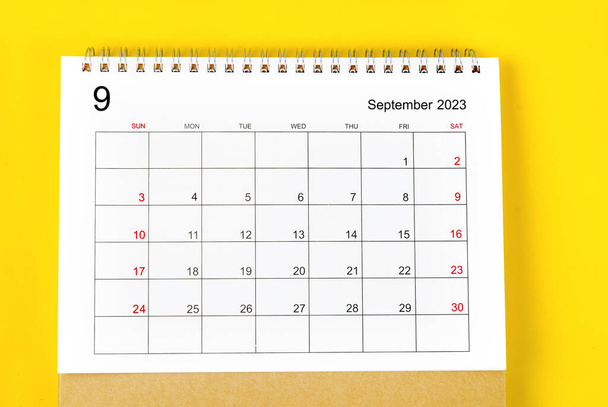 September 2023 Monthly desk calendar for 2023 year on yellow background. - Zdjęcie, obraz