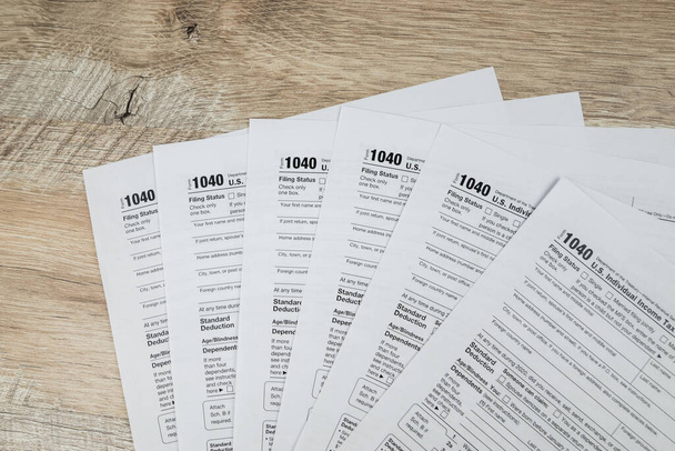 The concept of the deadline for paperwork. Blank tax form. Tax deadline concept.1040 tax forms.financial document - Фото, зображення