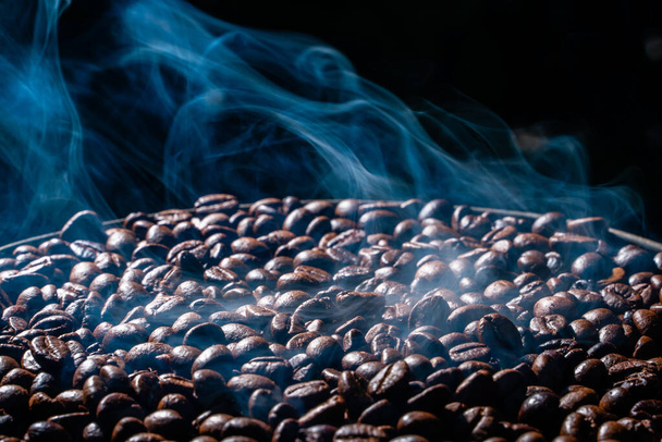 Coffee beans roasting with smoke,  selective focus, and soft focus. - Fotografie, Obrázek