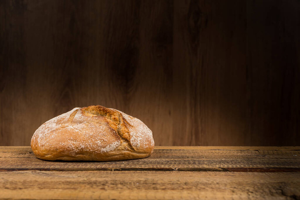 Close up of white bread over wooden background - Photo, Image