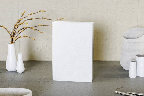 Rendering 3D di libro bianco posizionato vicino a candele e vaso con rami gialli - Foto, immagini