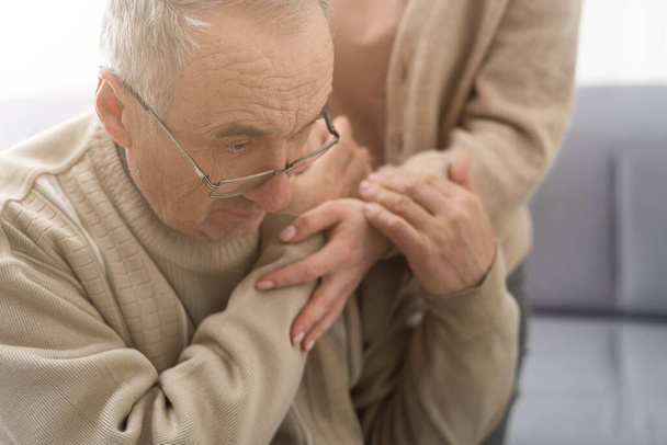 Nurse holding hand of senior man in rest home. - Photo, Image