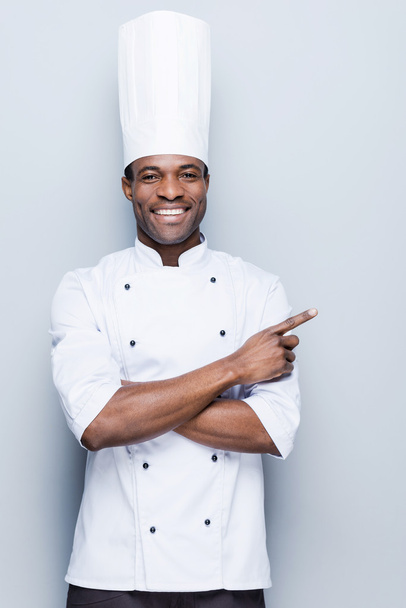 African chef pointing away - Foto, Imagem